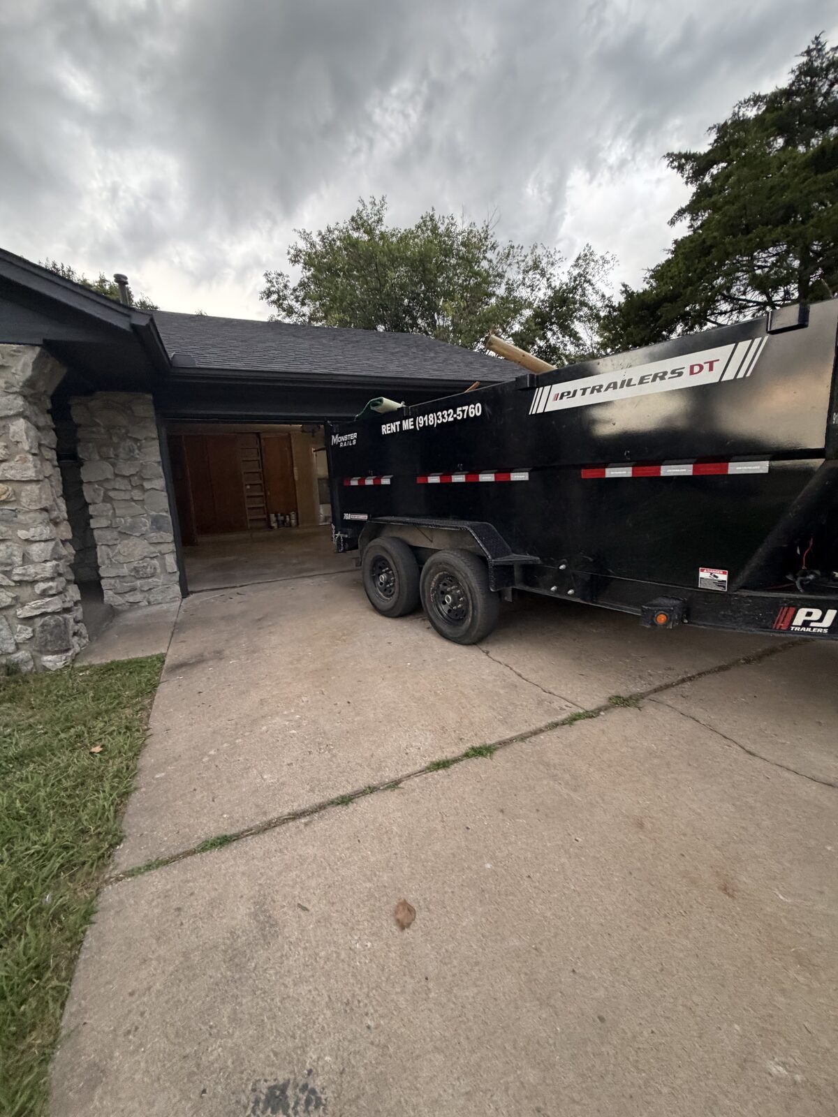 Monster Rails dump trailer on-site