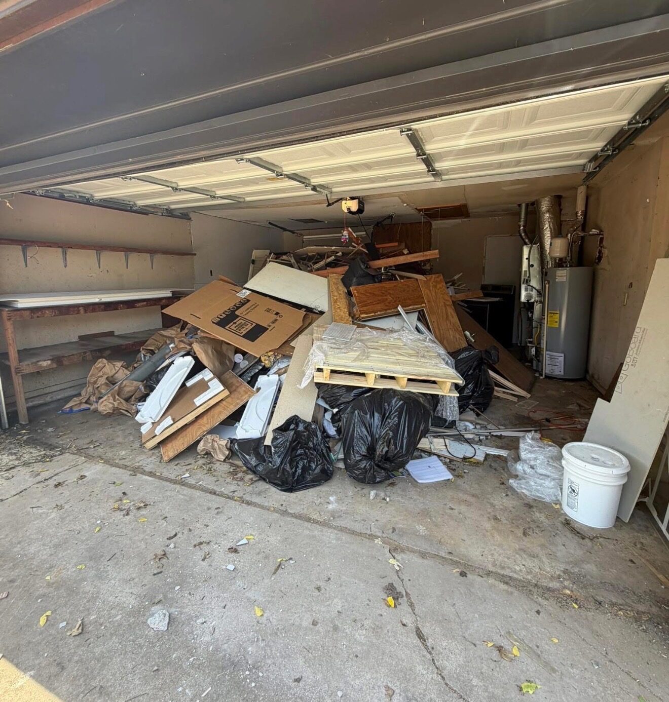 Loading furniture into a junk removal trailer